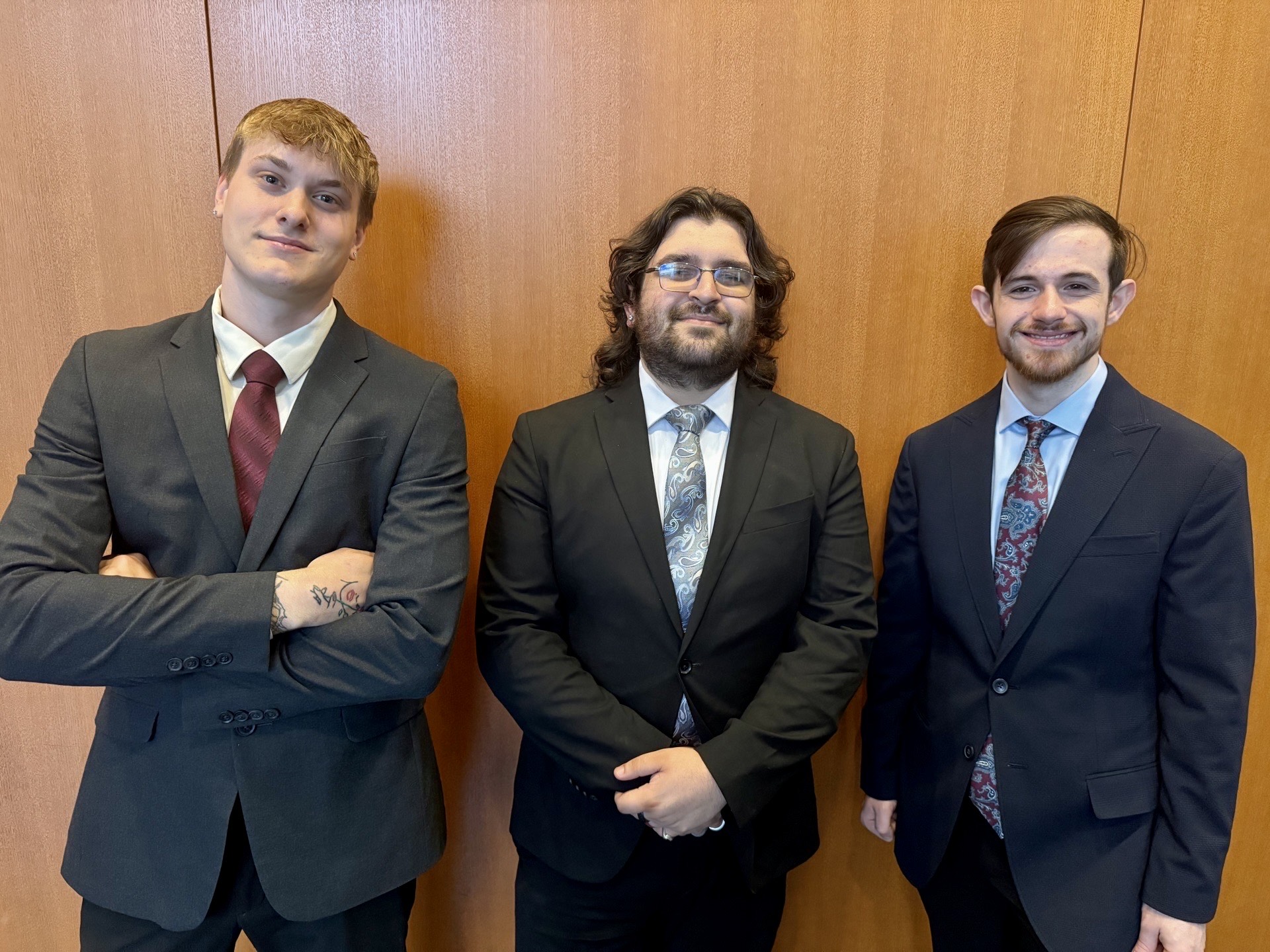 Three Valiant Branch team members in professional business attire
